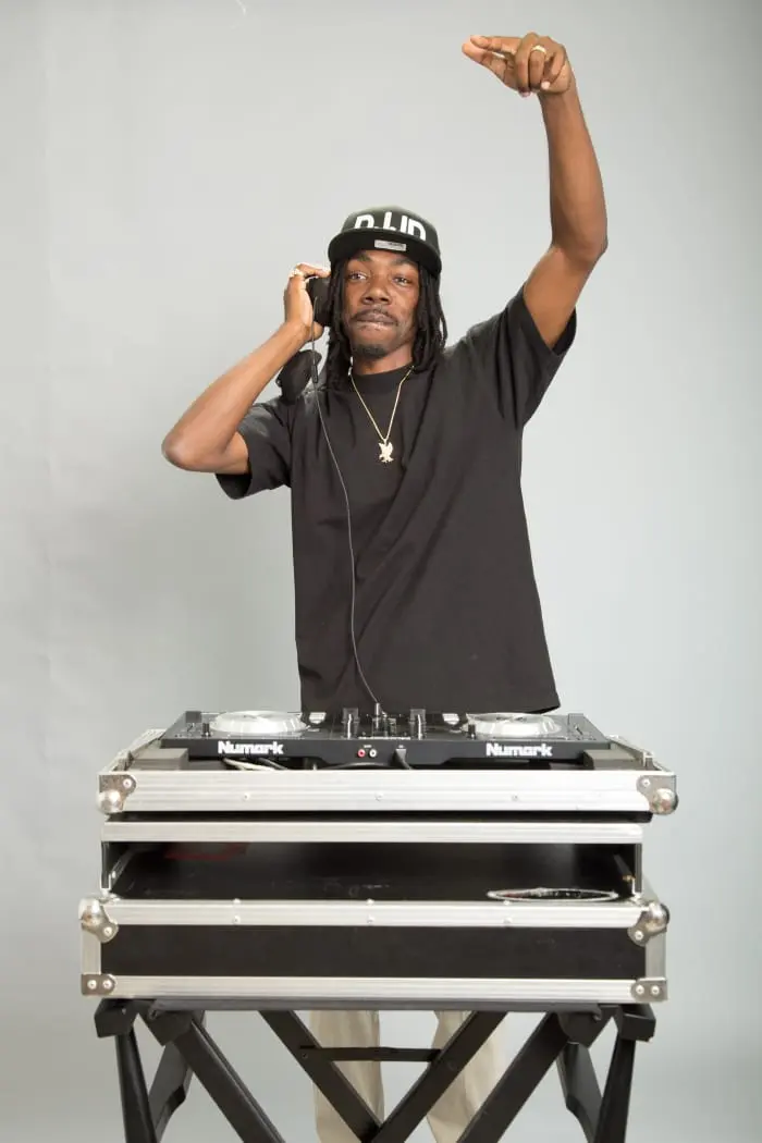 DJ JD performing behind his DJ controller