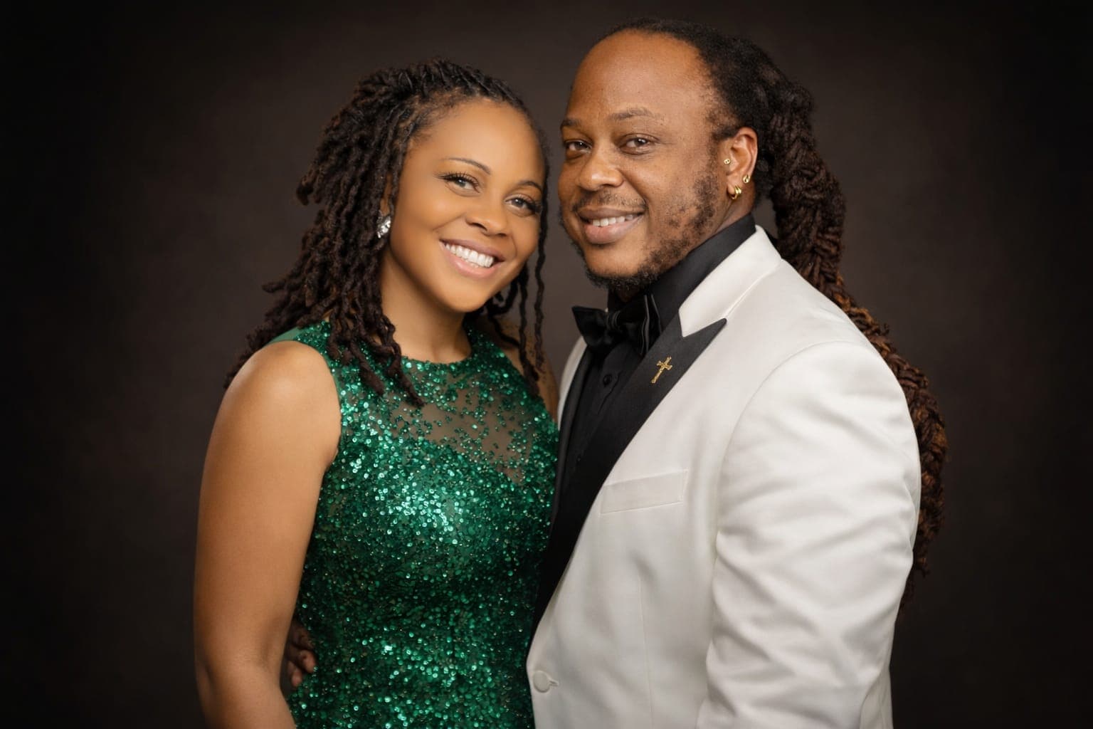 The two members of The God Movement dressed in formal attire